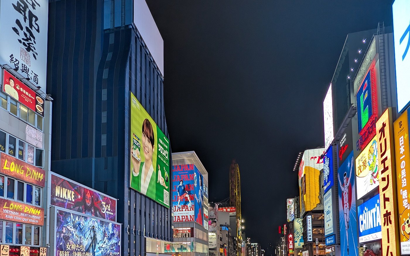 Dotonbori at dusk with the canal lit up