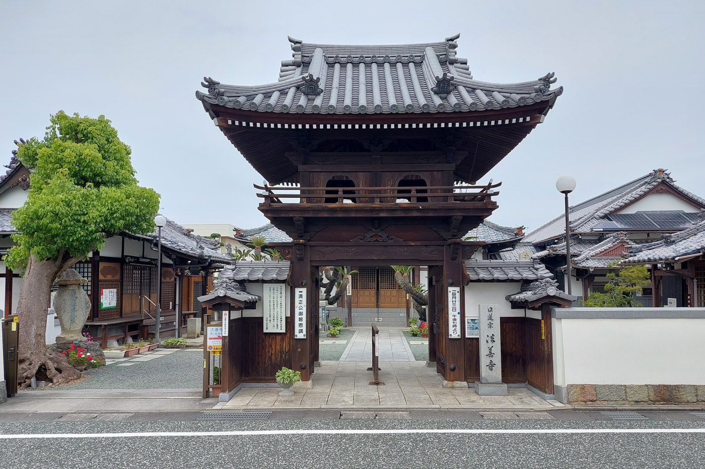 Hozenji temple in Osaka, its hall and the moss-covered Fudo statue