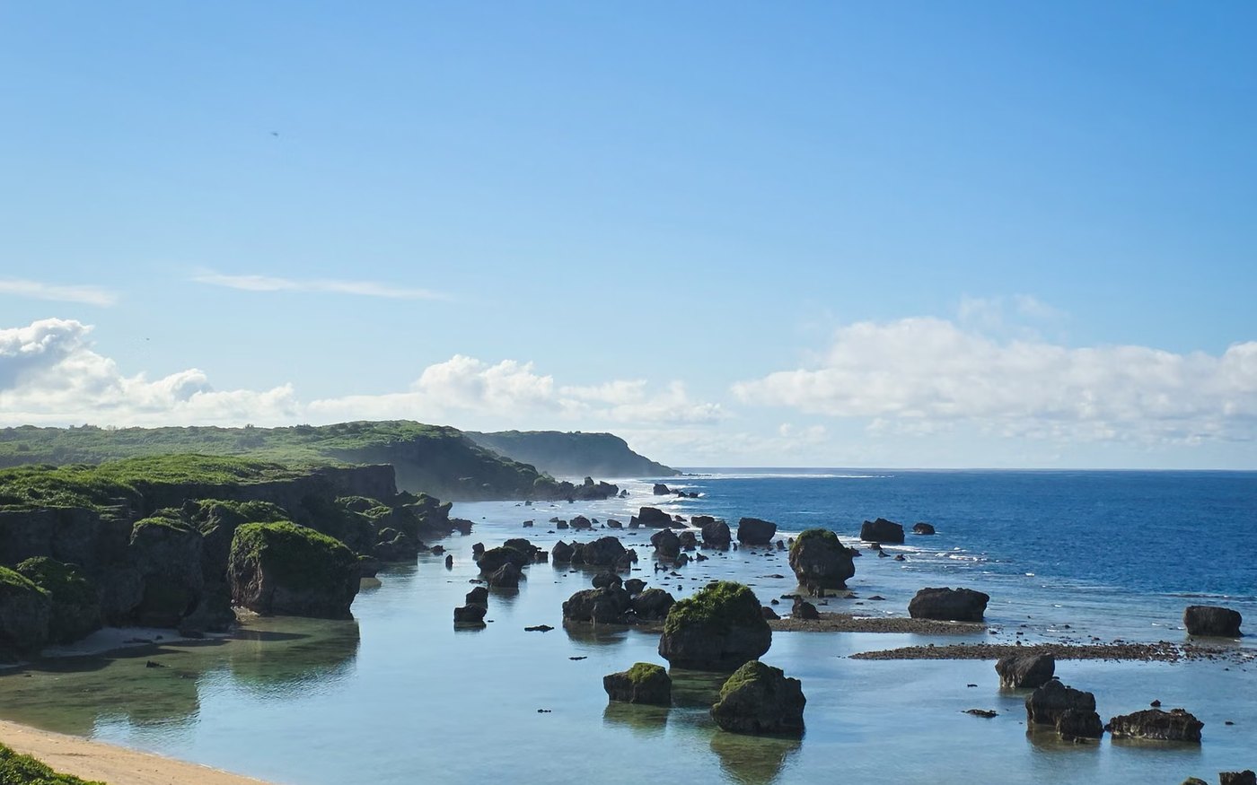 The rocky Miyakojima coastline in Okinawa under a clear sky