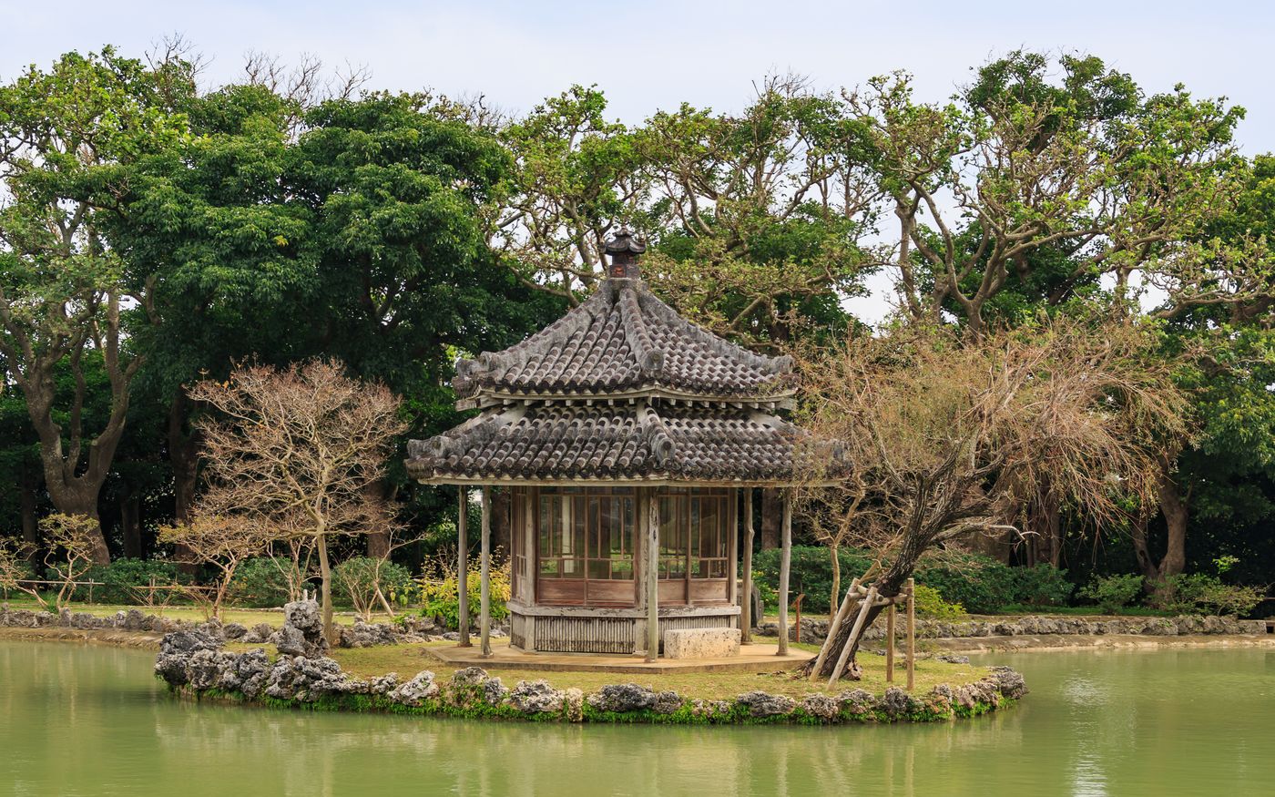 The hexagonal Chinese-influenced pavilion on a small island in the pond at Shikinaen garden