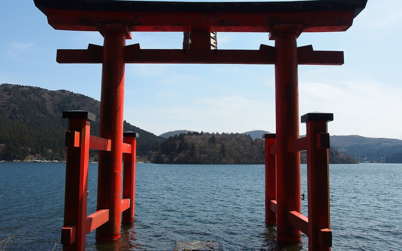 The torii gate of Hakone Shrine standing in Lake Ashi, seen from the water