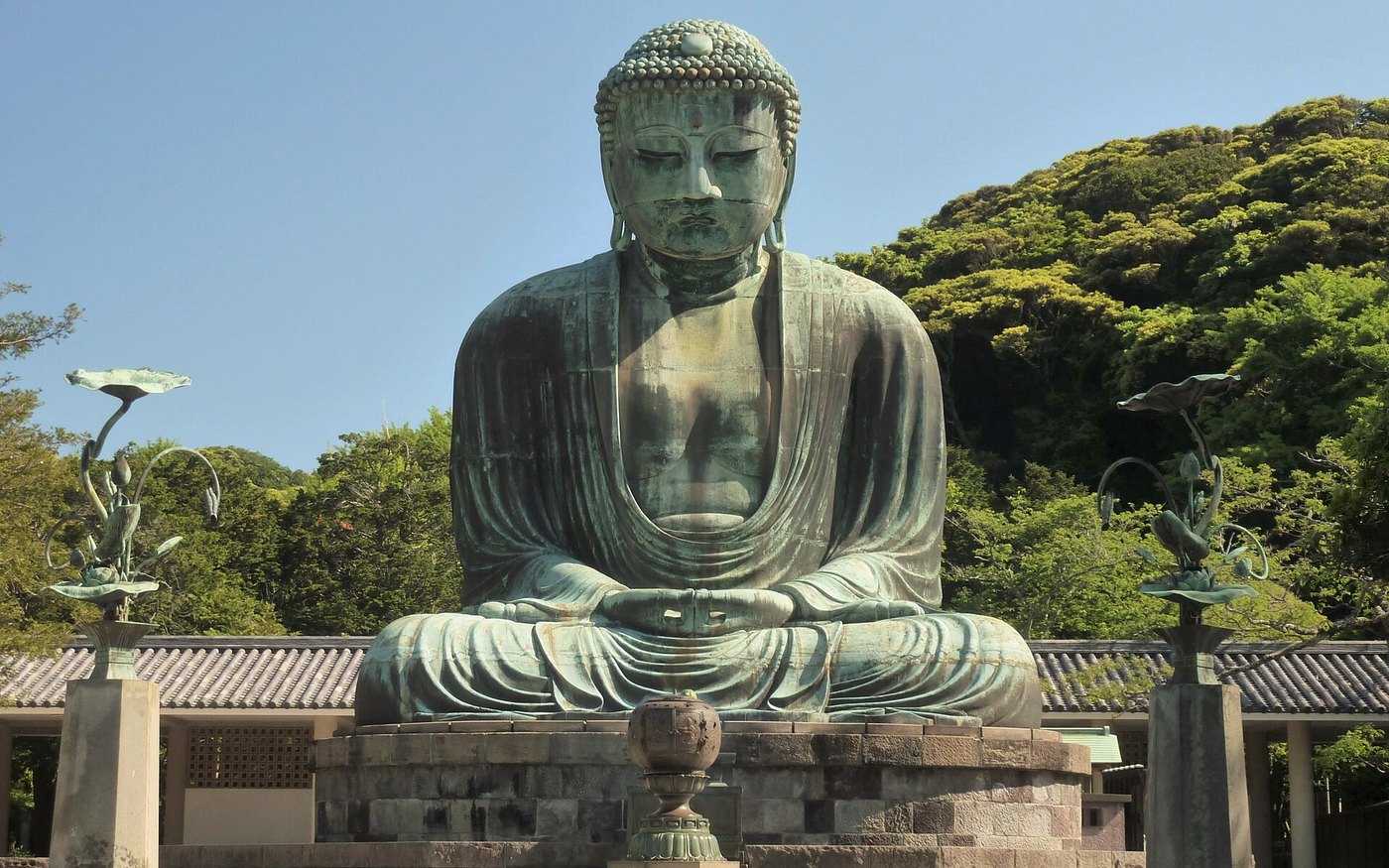 The Great Buddha of Kamakura at Kotoku-in, seated in the open on its stone platform