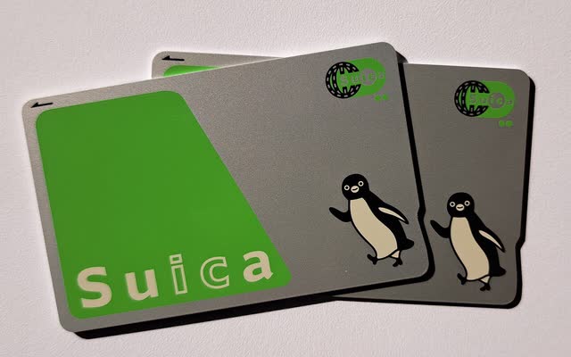 Suica cards fanned out on a plain surface