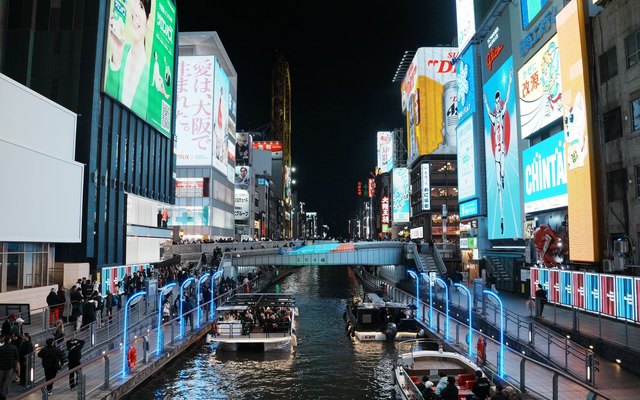 The Dotonbori canal at night, neon on both banks