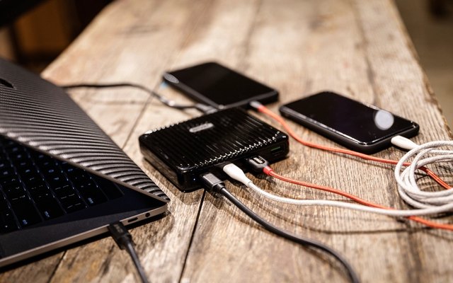 A power bank and cable in a departure lounge