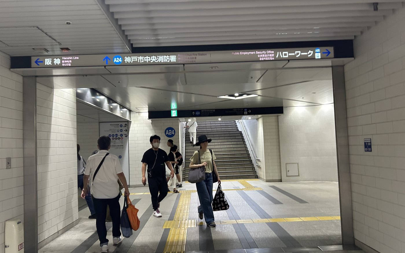 Signage for exit A24 in the underground concourse at Hanshin Kobe-Sannomiya