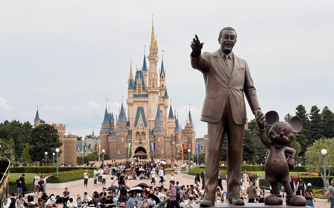 Statue of Walt Disney and Mickey Mouse in front of Cinderella Castle, Tokyo Disneyland